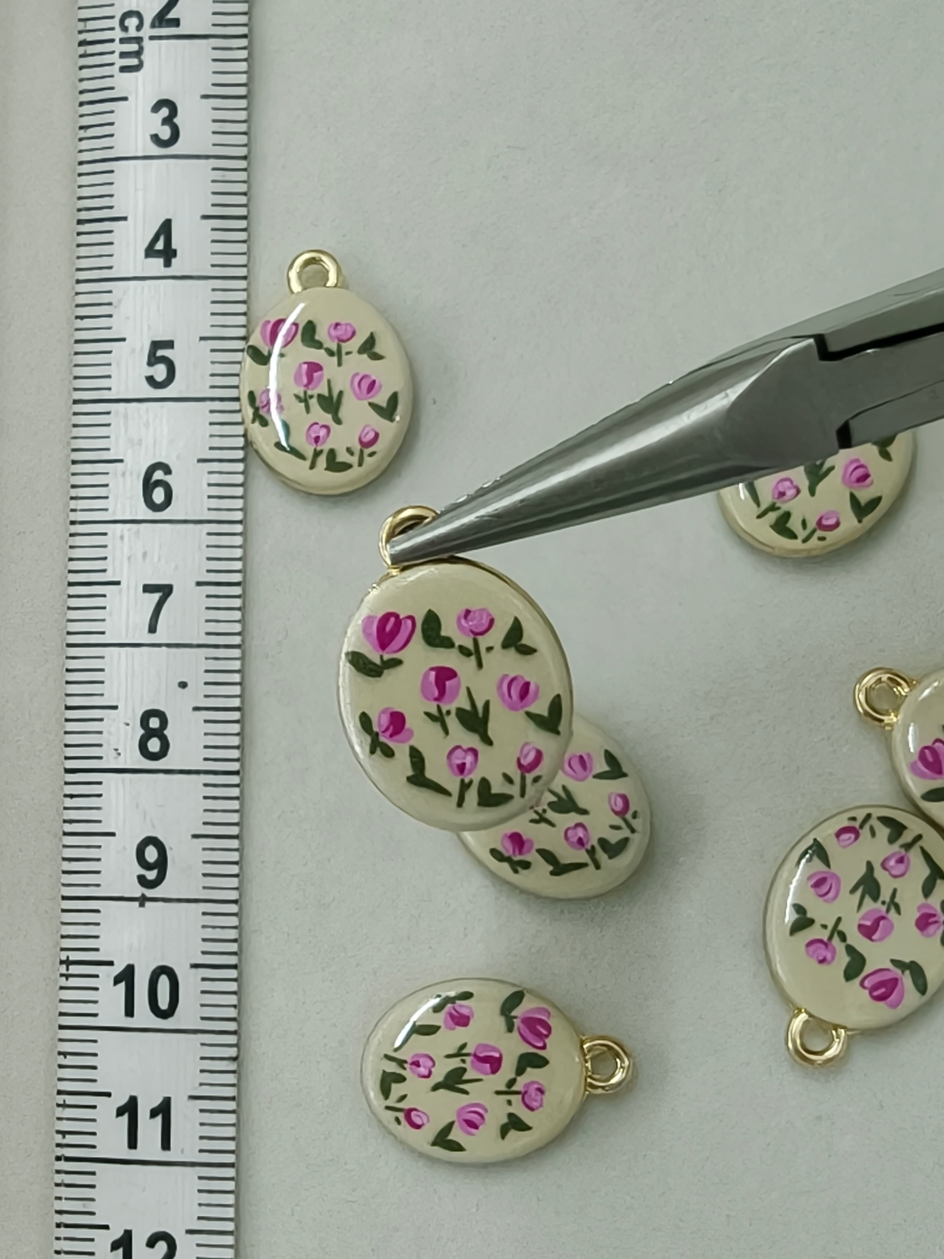 Two sided enamel charms