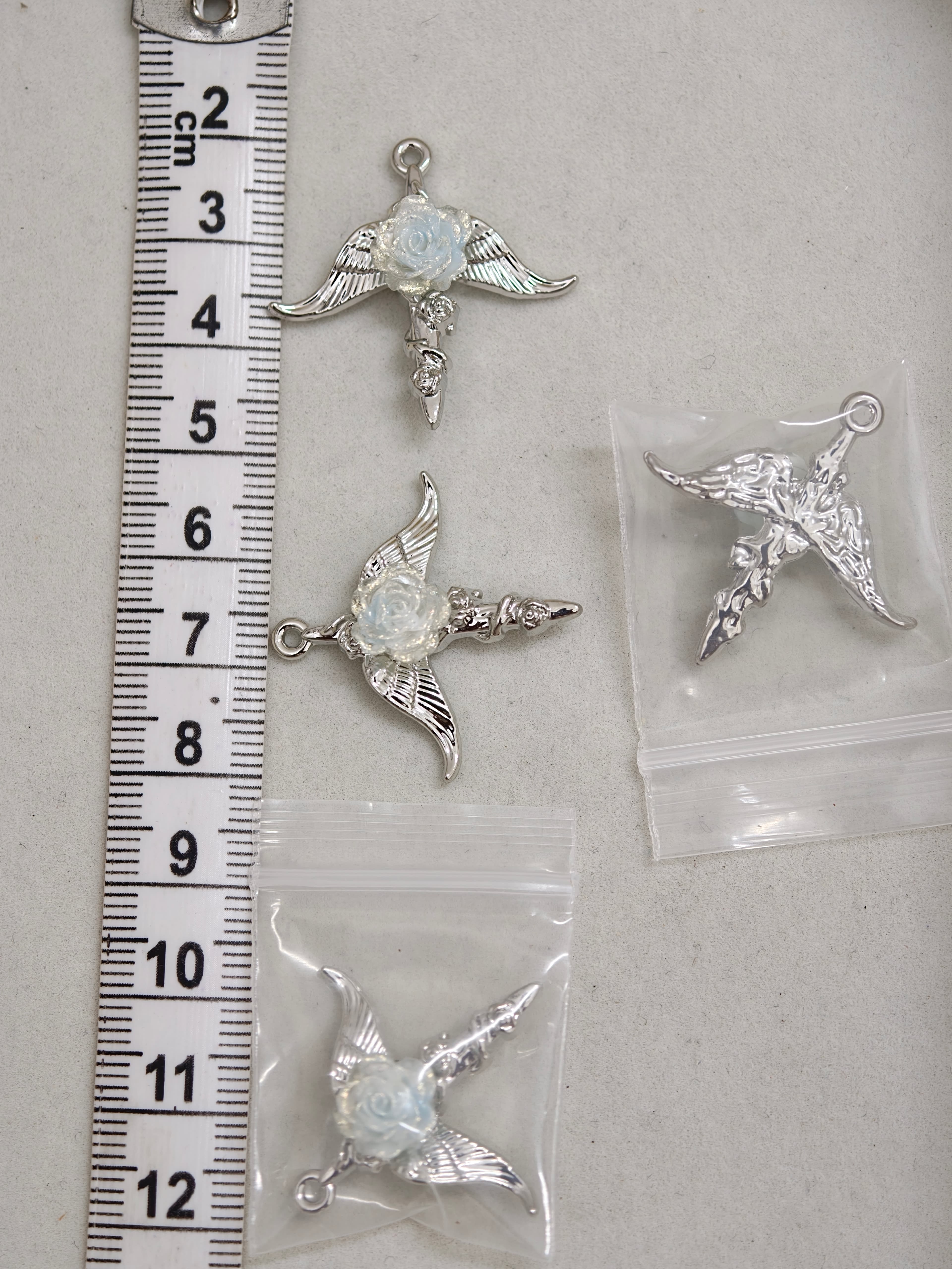 Blue rose angel charm