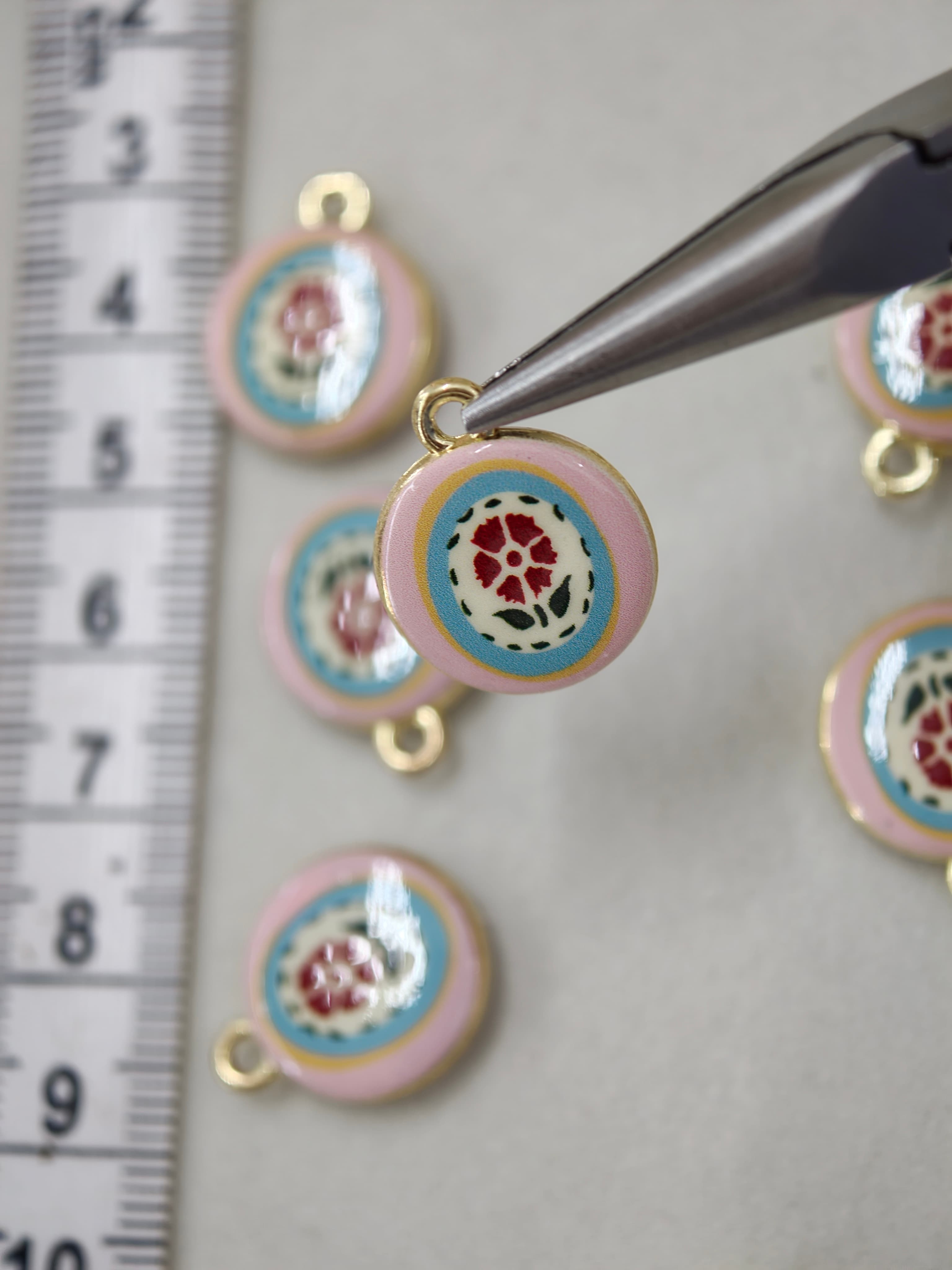 Two sided enamel charms