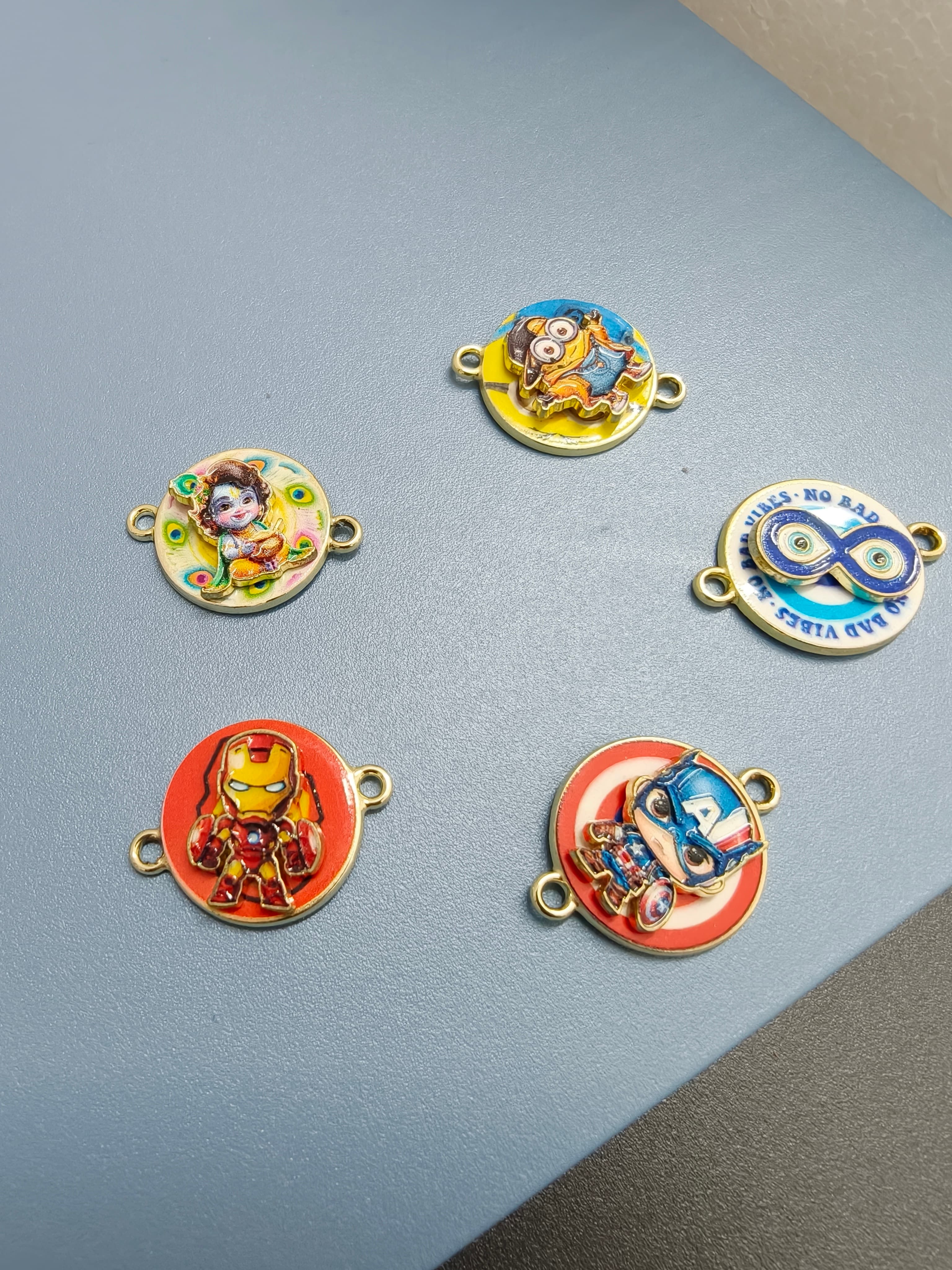 Spinning rakhi charms